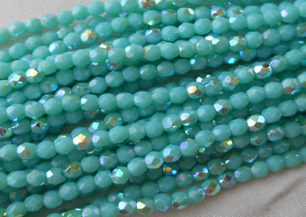 Fifty 3mm Opaque Turquoise AB Czech glass, firepolished, faceted round beads, C4550