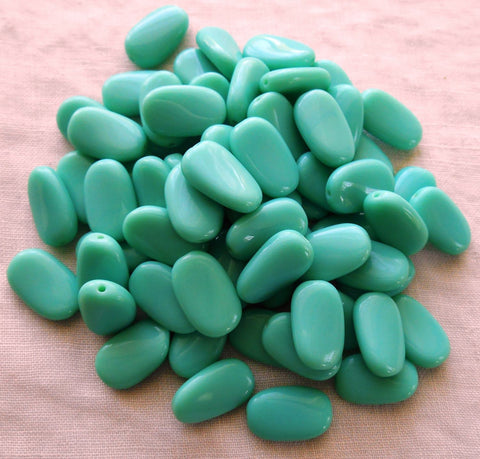 Lot of 25 Opaque Turquoise slightly twisted oval Czech pressed Glass beads, 14mm x 8mm, 03125 - Glorious Glass Beads