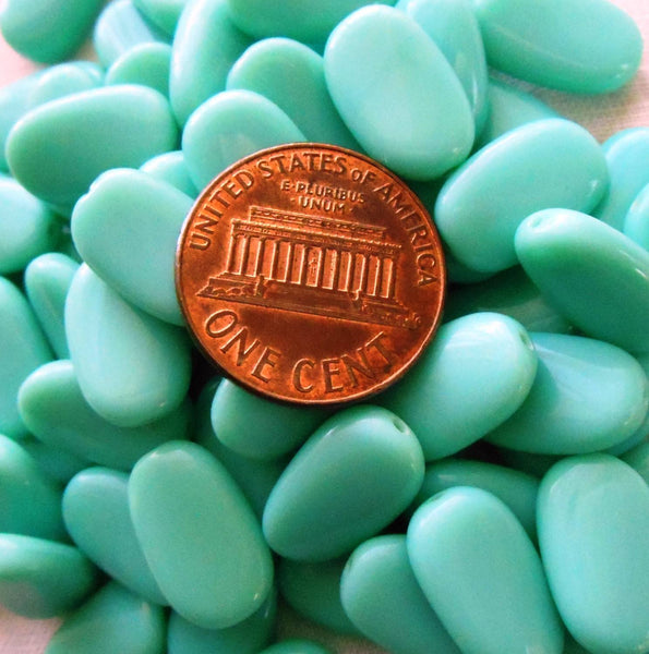 Lot of 25 Opaque Turquoise slightly twisted oval Czech pressed Glass beads, 14mm x 8mm, 03125 - Glorious Glass Beads