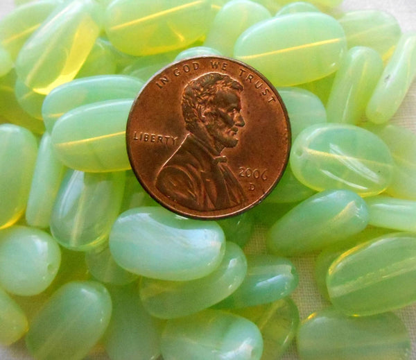 Lot of 25 Light Mint Green Opal slightly twisted oval Czech pressed Glass beads, 14mm x 8mm, C8925 - Glorious Glass Beads