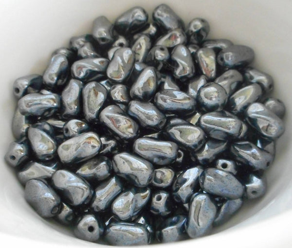 Lot of 25 9mm x 6mm Hematite gray metallic Czech glass small twisted oval beads, C2725 - Glorious Glass Beads