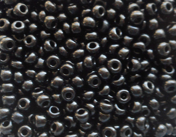 One pkg 24 grams Opaque Jet Black Czech 6/0 large glass seed beads, size 6 Preciosa Rocaille 4mm spacer beads, large, big hole C434 - Glorious Glass Beads