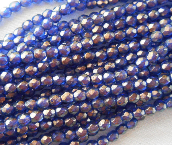 Fifty 3mm Halo Ultramarine Blue Czech glass over gold, firepolished, faceted round beads, C7750