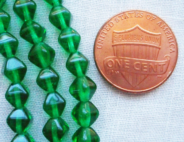 Fifty 6mm Emerald Green bicones, pressed glass Czech bicone beads C5501 - Glorious Glass Beads