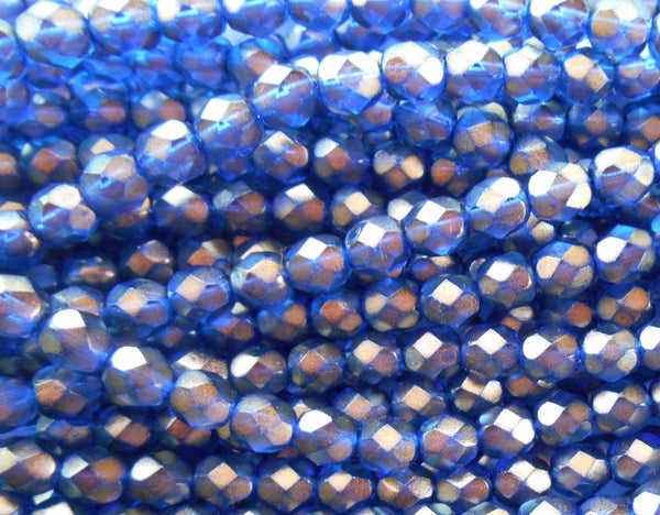 Lot of 25 6mm Halo Ultramarine blue glass, firepolished, faceted round beads with a gold finish, C5525