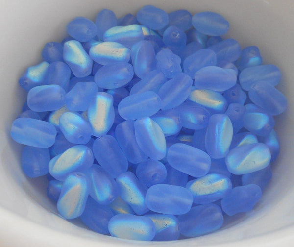 Lot of 25 9mm x 6mm Frosted Sapphire Blue AB Czech glass twisted oval beads, C3325 - Glorious Glass Beads