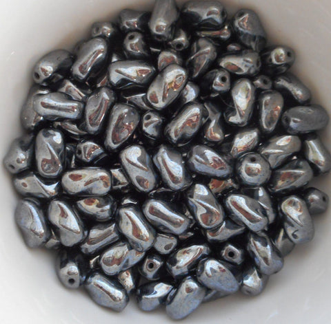 Lot of 25 9mm x 6mm Hematite gray metallic Czech glass small twisted oval beads, C2725 - Glorious Glass Beads