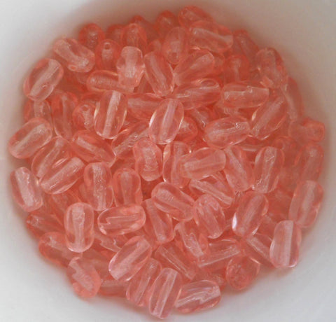 Lot of 25 9mm x 6mm light pink Czech glass twisted oval beads, C6325 - Glorious Glass Beads