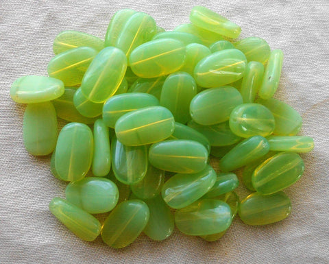 Lot of 25 Light Mint Green Opal slightly twisted oval Czech pressed Glass beads, 14mm x 8mm, C8925 - Glorious Glass Beads