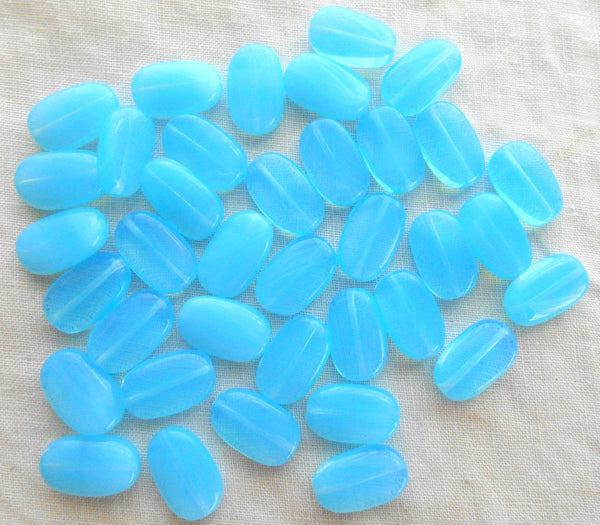 Lot of 25 Powder Blue Opal slightly twisted oval Czech pressed Glass beads, 14mm x 8mm, C3625 - Glorious Glass Beads