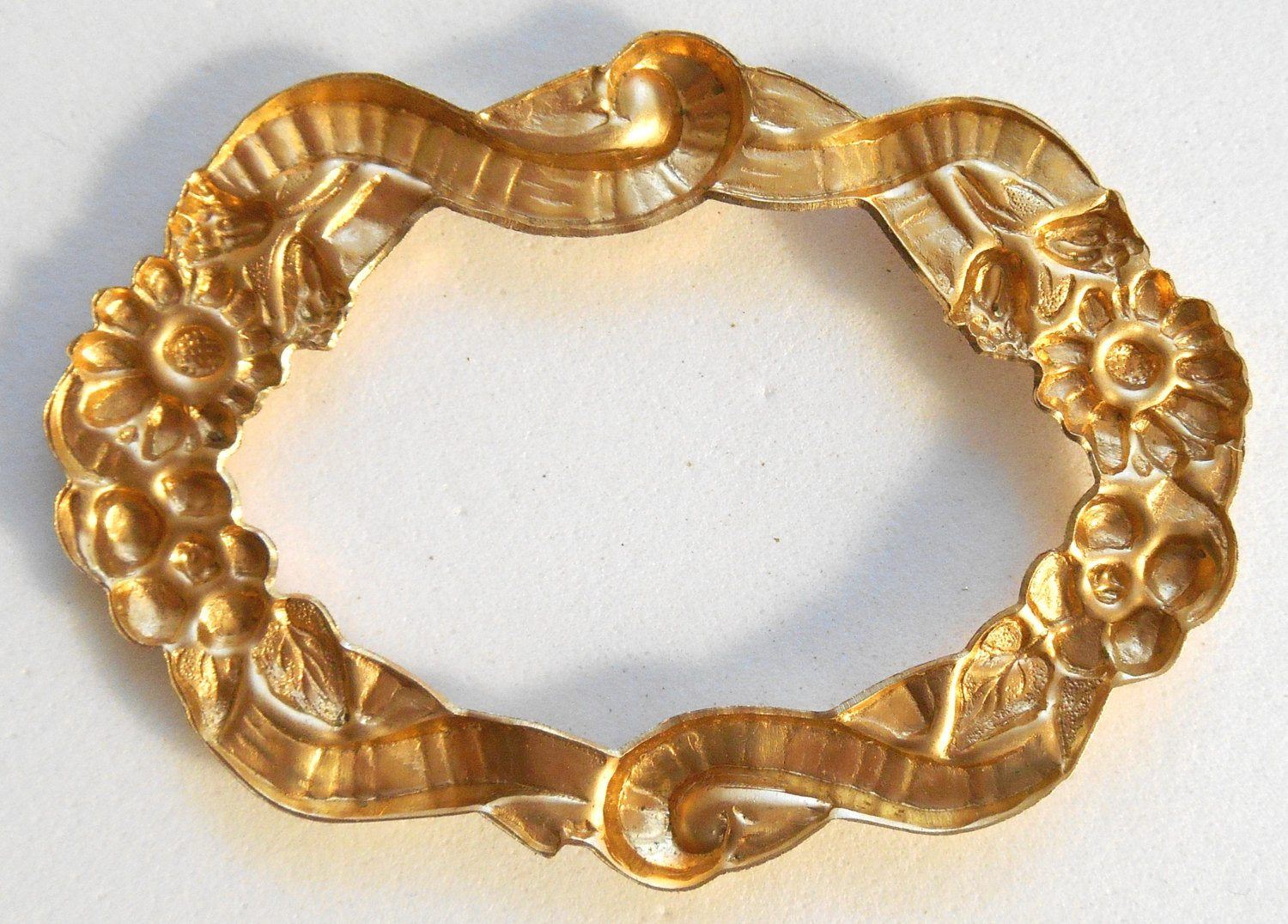 One raw brass stamping, oval frame in flowers and ribbons, pendant, connector, 50 x 35mm, made in the USA, C7501 - Glorious Glass Beads